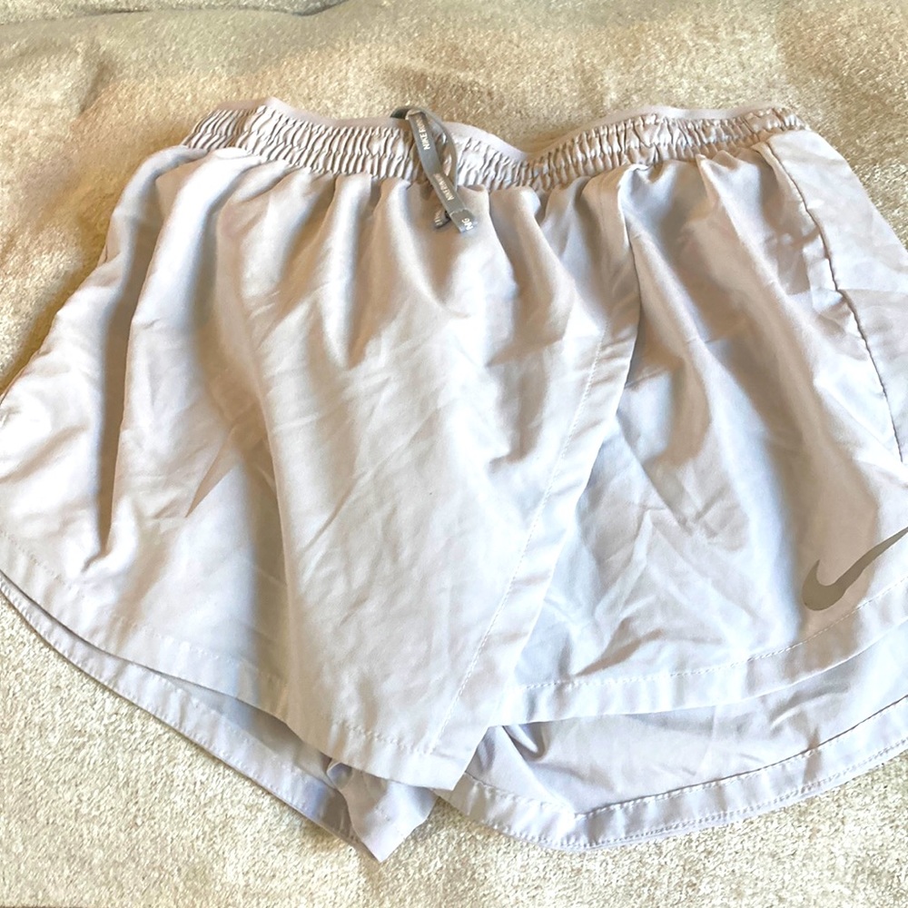 BRAND NEW!! Nike running skort! Grey and has adjustable waist strings.